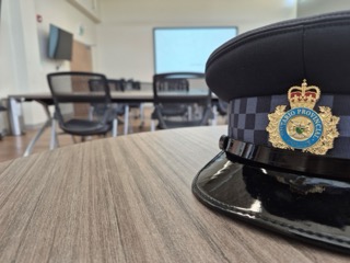 Ontario Provincial Police crest on a dark blue hat
